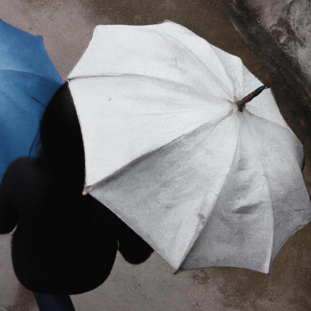 Person holding umbrella in rain